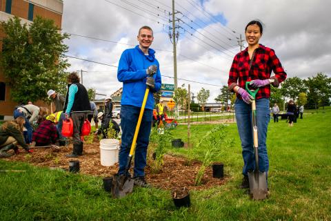 Volunteers pose during a lawn naturalization event at the Grey County Administration Office