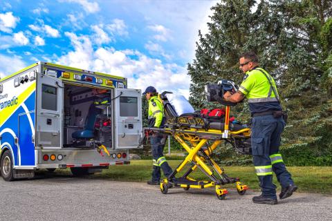 Grey County paramedics load equipment into ambulance