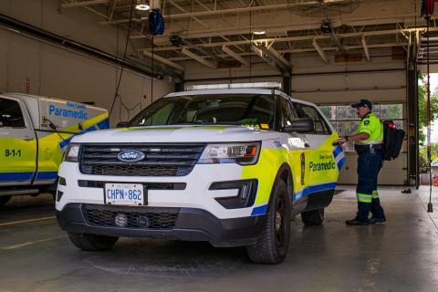 A community paramedic entering a community paramedicine vehicle.  