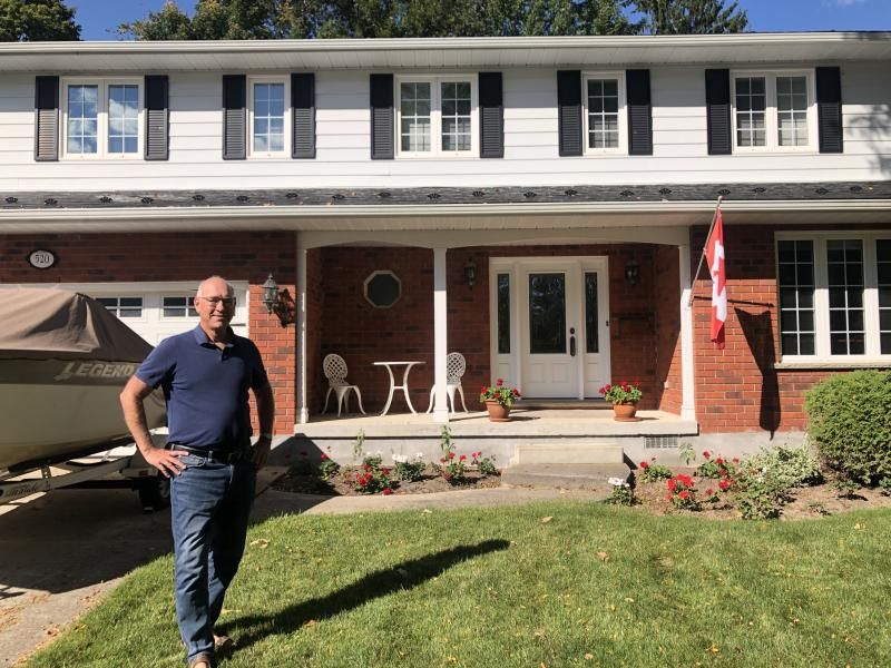 Jeff standing in front of his house