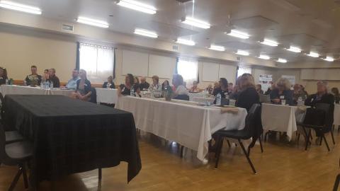 Attendees of the CMHC event observe speakers at the symposium in Elmwood Ontario.