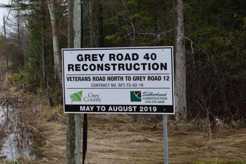 Road construction sign for Grey Road 40 with the Grey County and Harold Sutherland logos