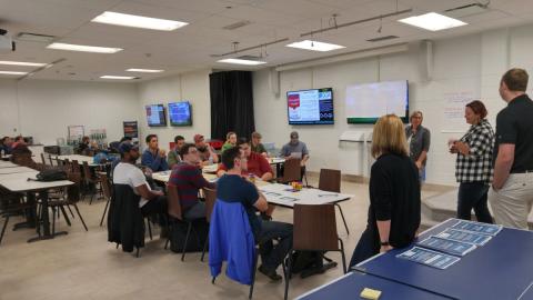 Hackathon competitors listening to experts in a Georgian College classroom.