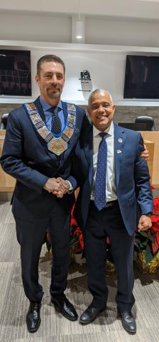 2020 Warden Paul McQueen is presented the chain of office by Deputy Warden Selwyn Hicks.