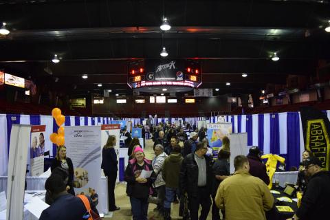 Photo of the 2020 Regional Job Fair showing businesses and job seekers on the arena floor at the bayshore