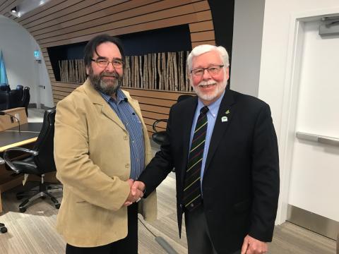 Grey County Warden Stewart Halliday (right) welcomes new alternate County Councillor John Woodbury.