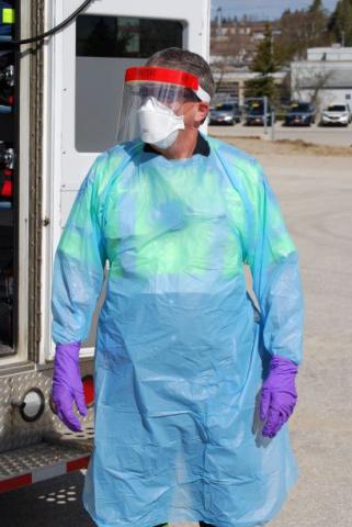 a Paramedic wearing full personal protective equipment for Covid-19