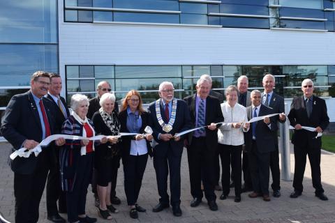 County Council cuts the ceremonial ribbon in front of the Grey County Administration Building