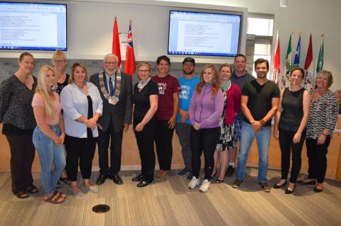 Participants in the Starter Company program stand with Warden Halliday and BEC staff in the Council Chamber