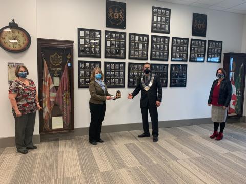 Grey County Warden Paul McQueen accepts his 2020 Warden's Pin from CAO Kim Wingrove. Also featured: Penny Colton and Heather Mor