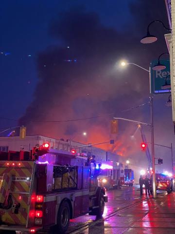 Photo of a fire engine outside of a burning building in downtown hanover.