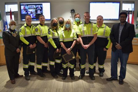 Paramedics receiving an award from the Medical Director