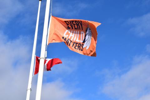 every child matters flag flying in front of the Grey County Administration Building